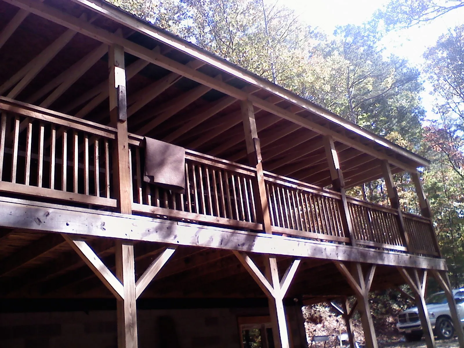 Timber framing under a new elevated porch and deck — Roof Leak Repair in South Greenfield by Roofing Brothers